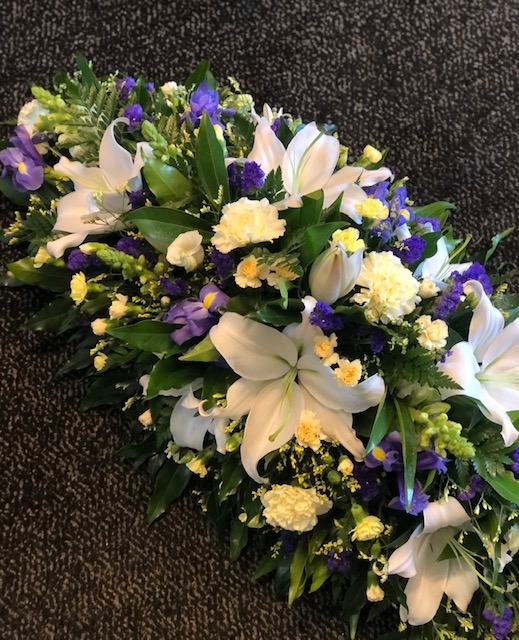 Blue, Yellow and White Casket Spray